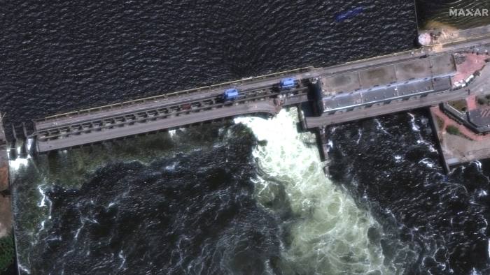 Drone footage shows water gushing out from the Kakhovka dam