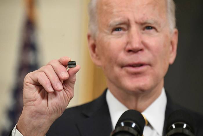 Us president Joe Biden holding a chip