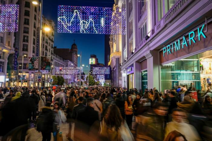 Shoppers gather outside a Primark store on the Gran Vía in Madrid