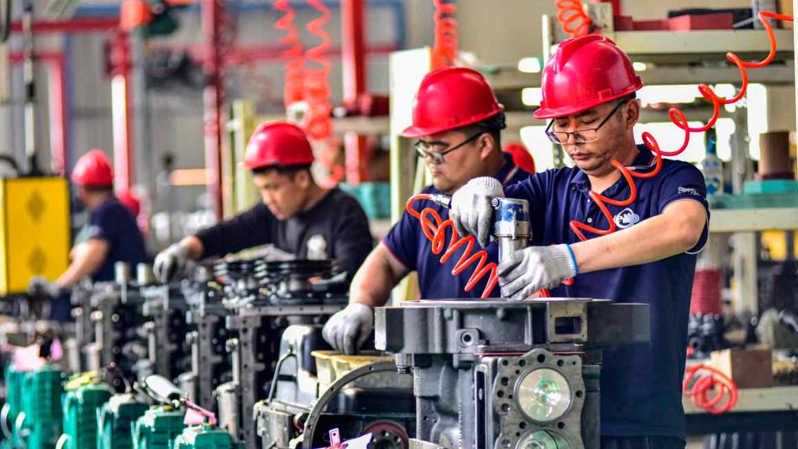 China warns west of ‘survival of the fittest’ as manufacturing boosts economy