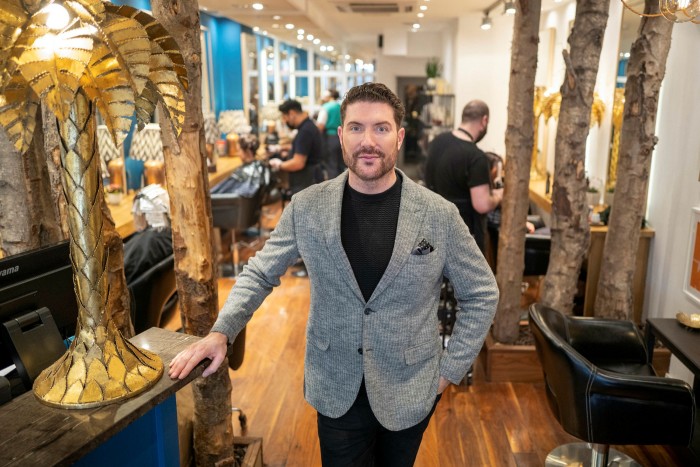 Edward James, owner of an upscale hair salon of the same name on his premises in Westminster