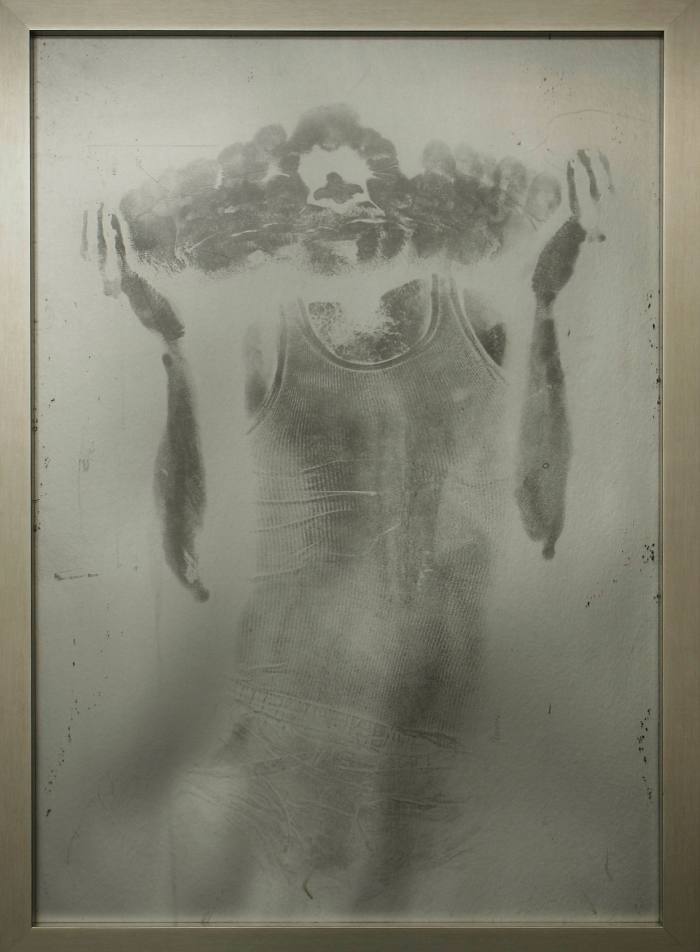 A body print of the artist on a canvas