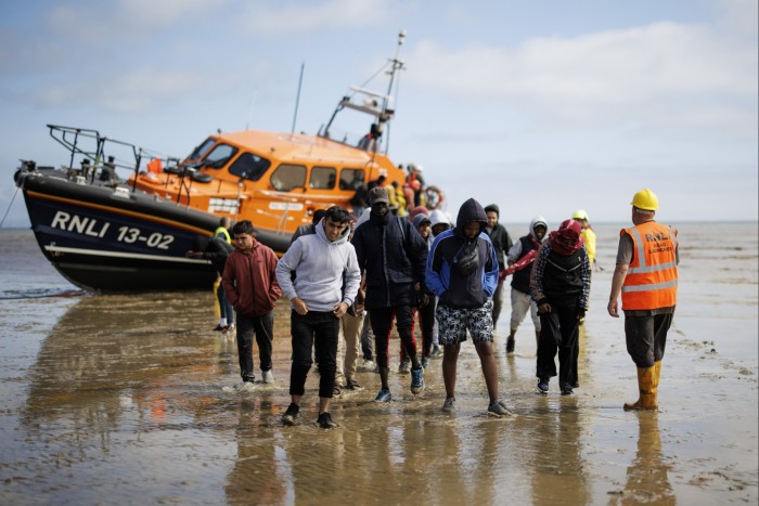 Migrants rescued from a boat crossing the English Channel