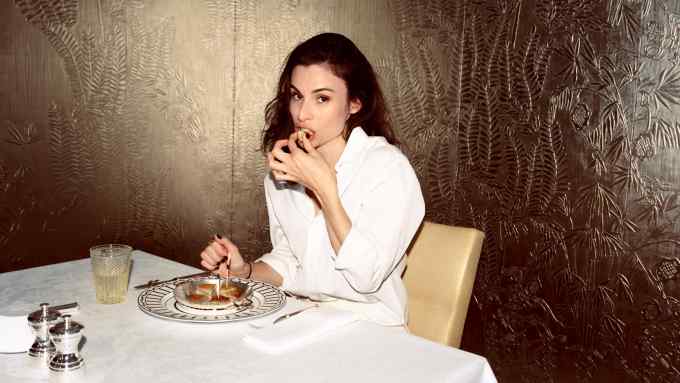 Alice Cavanagh eating in the dining room at Suite Dior 30 Montaigne