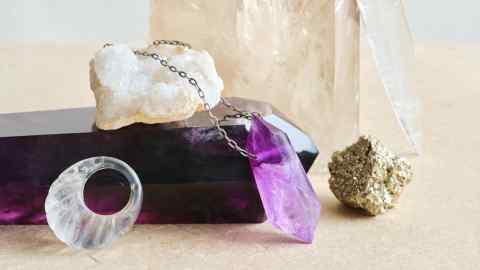 From top: Sophie Buhai quartz Crevice pendant, $1,800, and quartz Shell ring, $695.  Joseph Brooks amethyst Crystal necklace, $440.  Large crystals throughout: Zoë & Morgan large quartz, £150 each, and large amethyst, £380 each