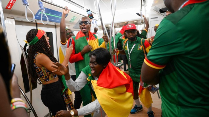 Cameroon fans cheer on the metro in Doha