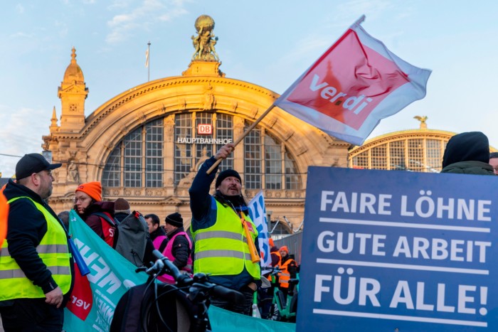 Public transport employees take part in a protest in front of Frankfurt’s central train station