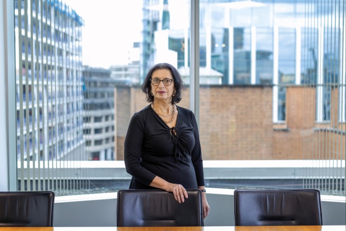Rachel de Souza, private client partner at accountancy firm RSM, standing behind a chair in an office with large glass walls