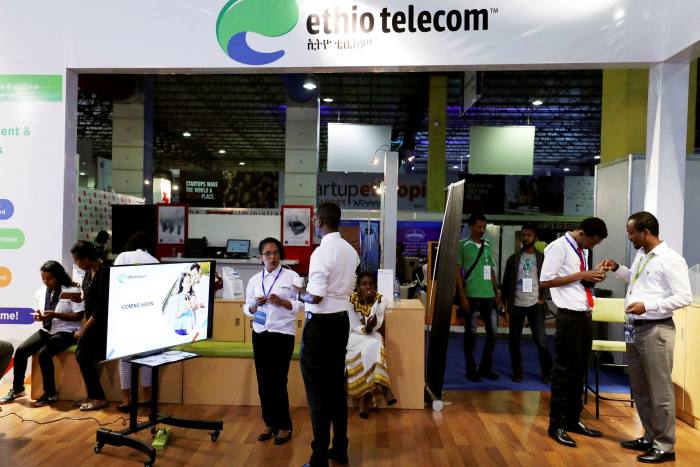 Staff help customers at an Ethio Telecom branch in Addis Ababa, in Ethiopia