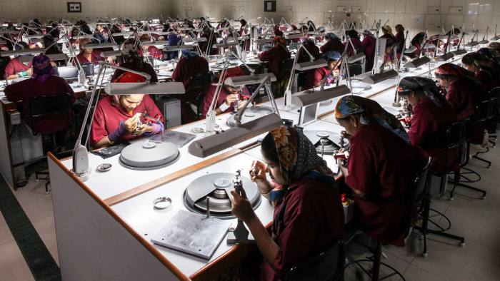 Dimexon workers cutting and polishing diamonds