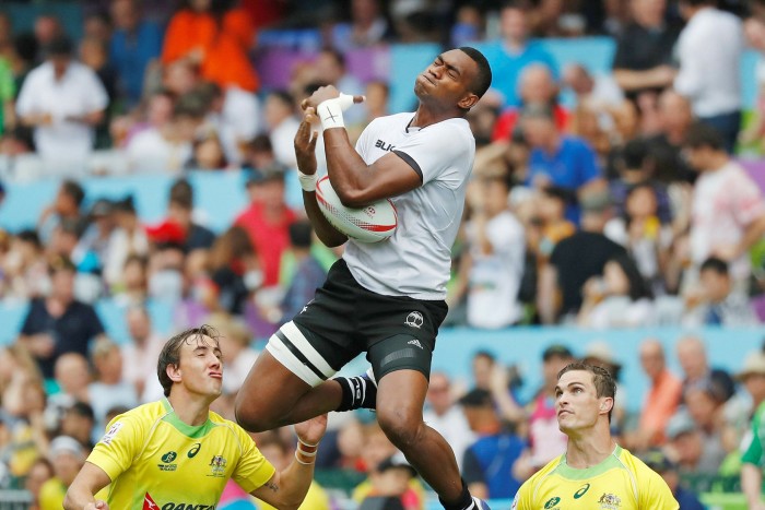 Fiji’s Mesulame Kunavula jumps for a ball during a semifinal match against Australia at the Hong Kong Sevens rugby tournament in 2017