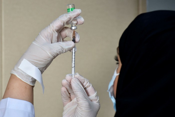 A medical worker prepares a dose of the AstraZeneca Covid-19 vaccine