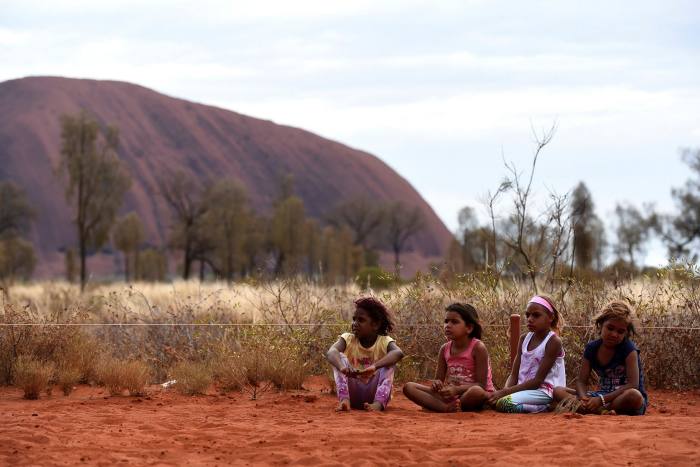 Aboriginal children near Uluru: secondments allow cadet lawyers to stay closer to their roots