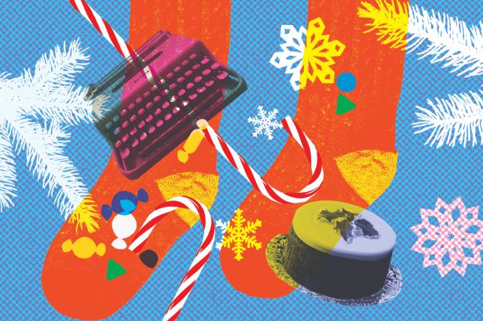 An illustration of Christmas stockings, snowflakes, candy canes, Christmas pudding and a typewriter