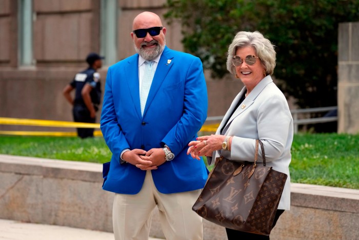 Chris LaCivita and Susie Wiles smile as they stand outside the Washington courthouse