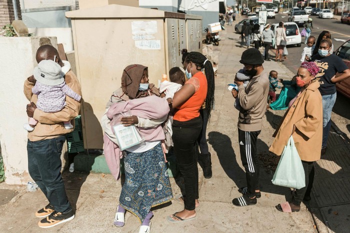 People queue for basic food items  in Durban. A local NGO leader, Mervyn Abrahams,  says ‘one of the big aims [of the looters] was to bring access to food to its knees’