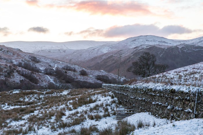 Snowy hills on Cumbria’s Aira Force and Gowbarrow Fell trail  