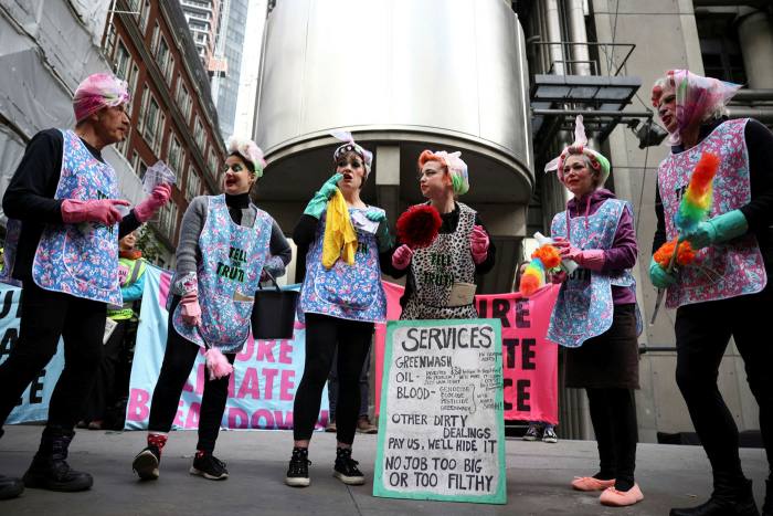 Extinction Rebellion activists protest outside the Lloyd’s of London building, London