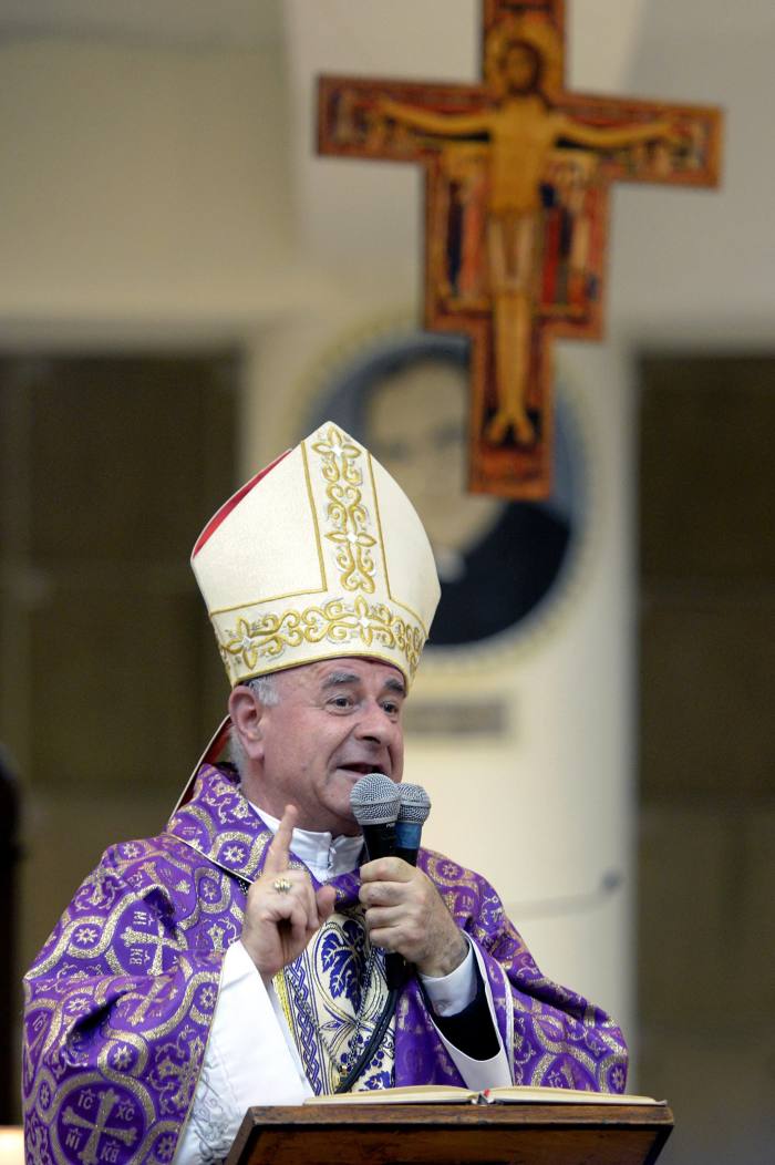Archbishop Vincenzo Paglia, the Catholic Church’s official emissary for AI, standing in a pulpit under a crucifix
