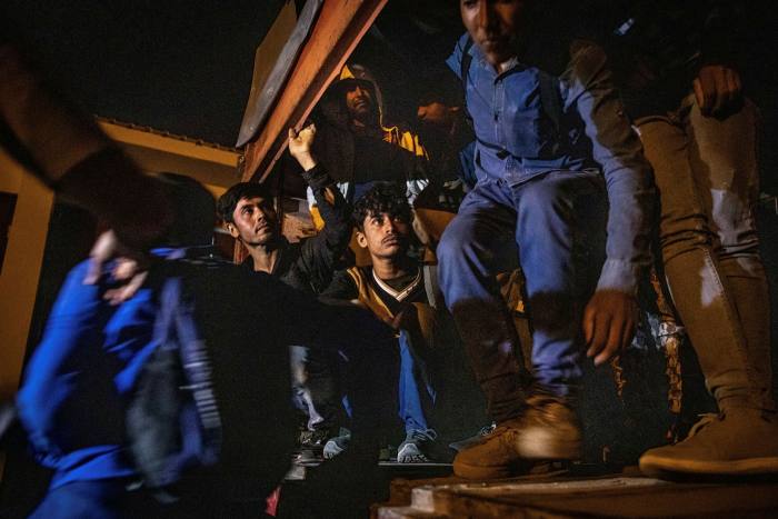Afghan migrants leaving a truck in Van, Turkey