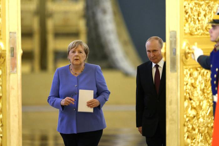 A photo of former German  chancellor Angela Merkel and Russian president Vladimir Putin