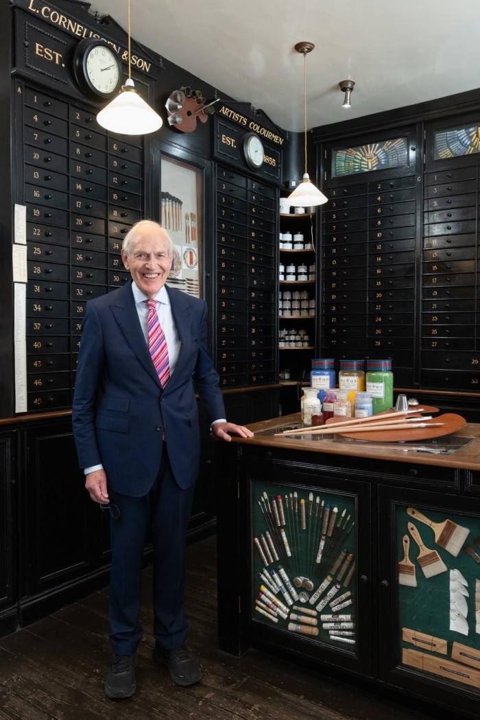Owner Nicholas Walt in front of the brush, pigment and gold leaf drawers