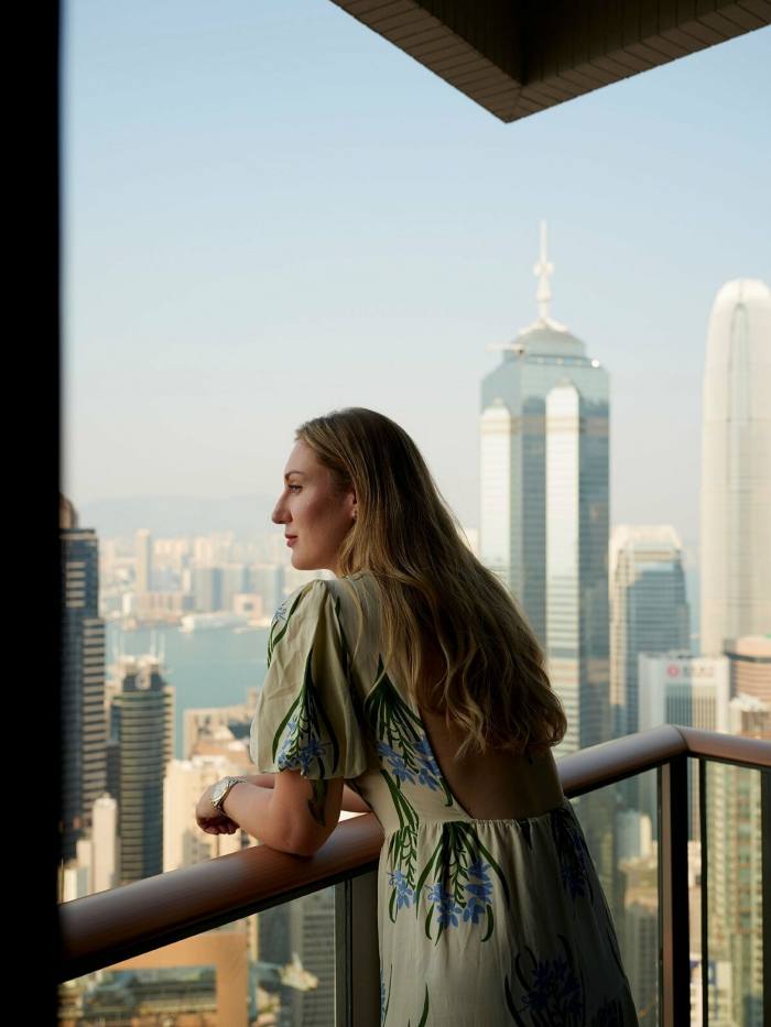 Kinder on the balcony of her 42nd-floor apartment in Mid-Levels district