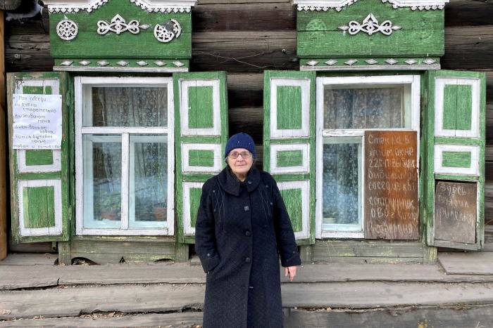 Chita resident Elvira Cheremnykh stands outside her house