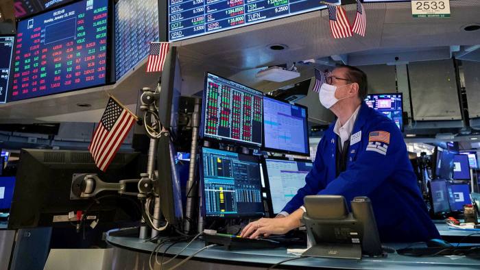 Specialist Patrick King works on the floor of the New York Stock Exchange