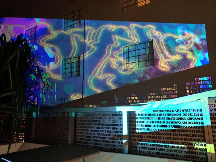 Swirling colours and lights projected onto an external wall of The Betsy hotel, as part of Indian-born artist Sri Prabha’s ‘Cosmic Occupancy’ installation