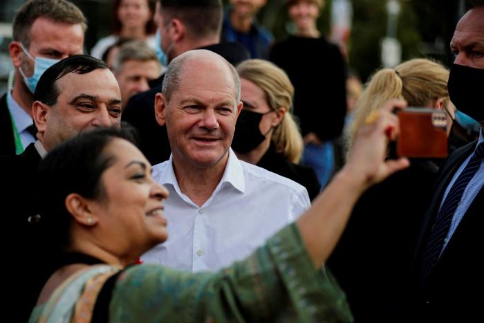 Olaf Scholz poses for a photograph in Potsdam