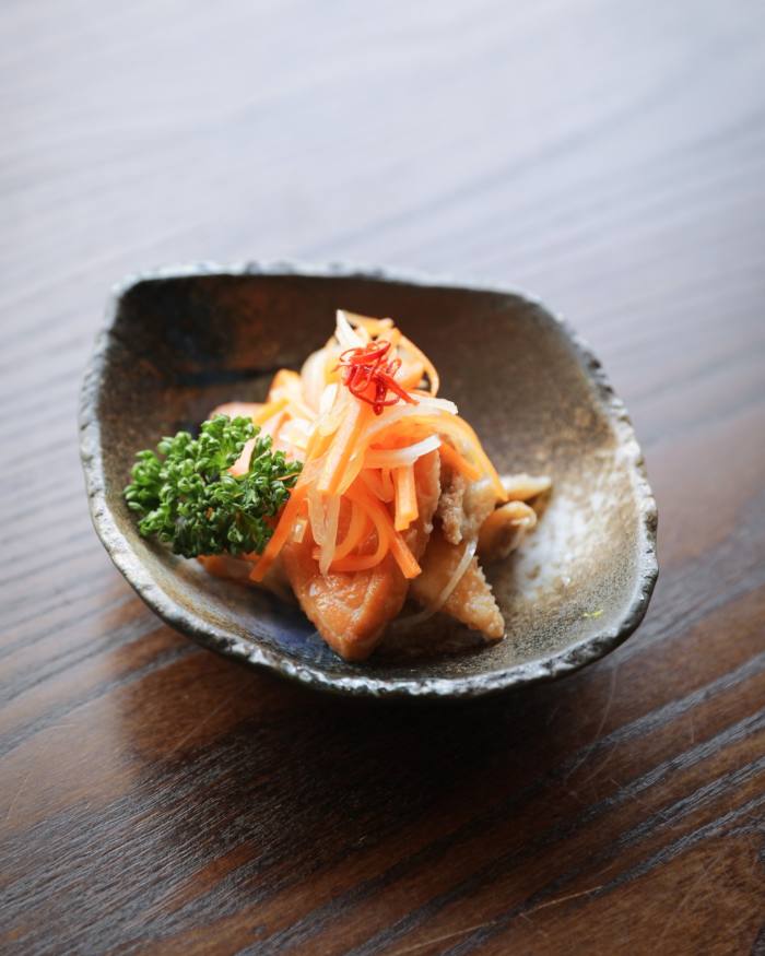 Dish of sakana nanban - sea bass, sea bream and salmon deep fried and marinated with vegetables and vinegar - in Jin Kichi