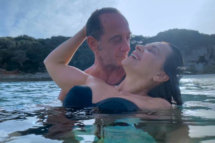 Actors Vincent Lindon and Juliette Binoche swim in a scene from the film 'Both Sides of the Blade'