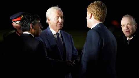 Joe Biden shaking hands with another man