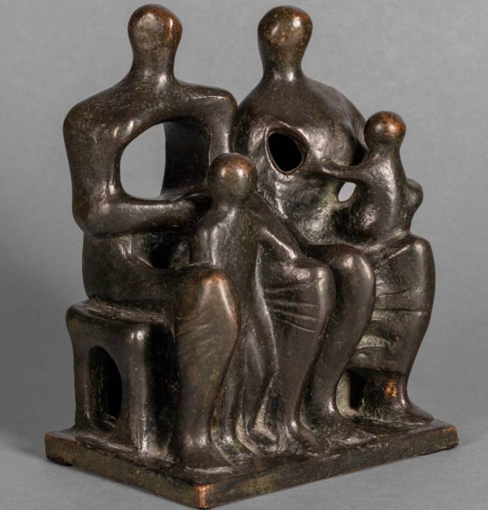 Small bronze sculpture of two seated grown-up figures with children