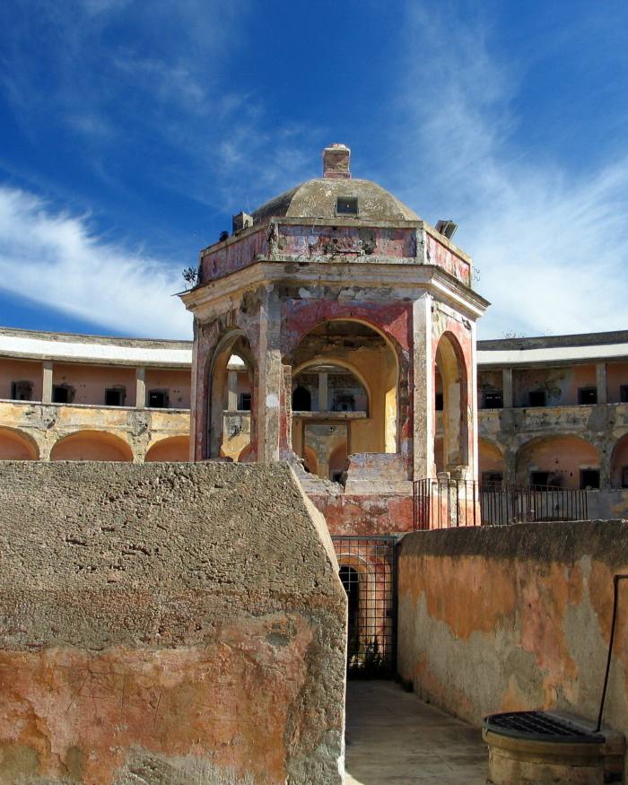 A watchtower surrounded by rows of cells in the former prison built by the Bourbons on the island of Santo Stefano
