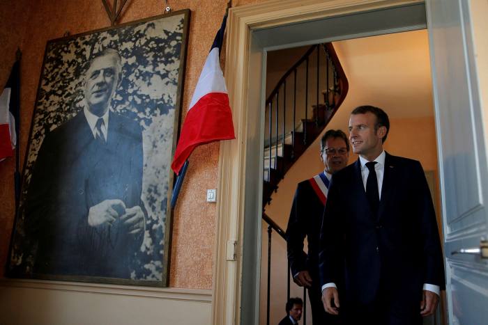 Emmanuel Macron and a portrait of Charles de Gaulle at Colombey-les-Deux-Eglises