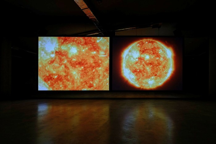 Video installation showing close-up and wide view of the surface of the Sun