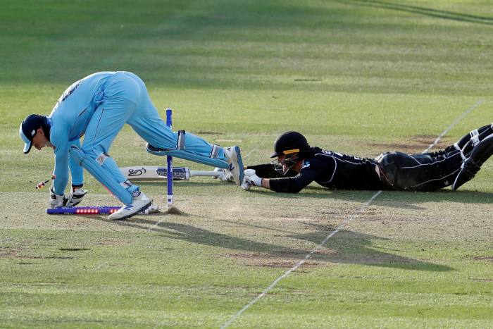 Wicketkeeper and Castore partner Jos Buttler (left) runs from New Zealand's Martin Guptill to clinch England's 2019 Cricket World Cup victory