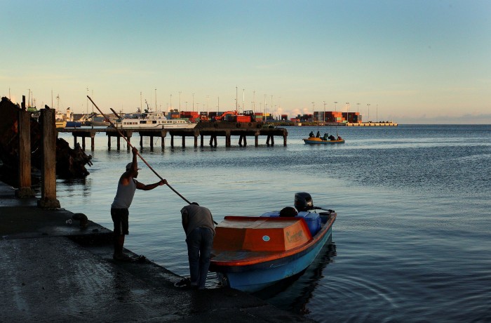 A man arrives at a dock in Honiara, the capital of the Solomon Islands