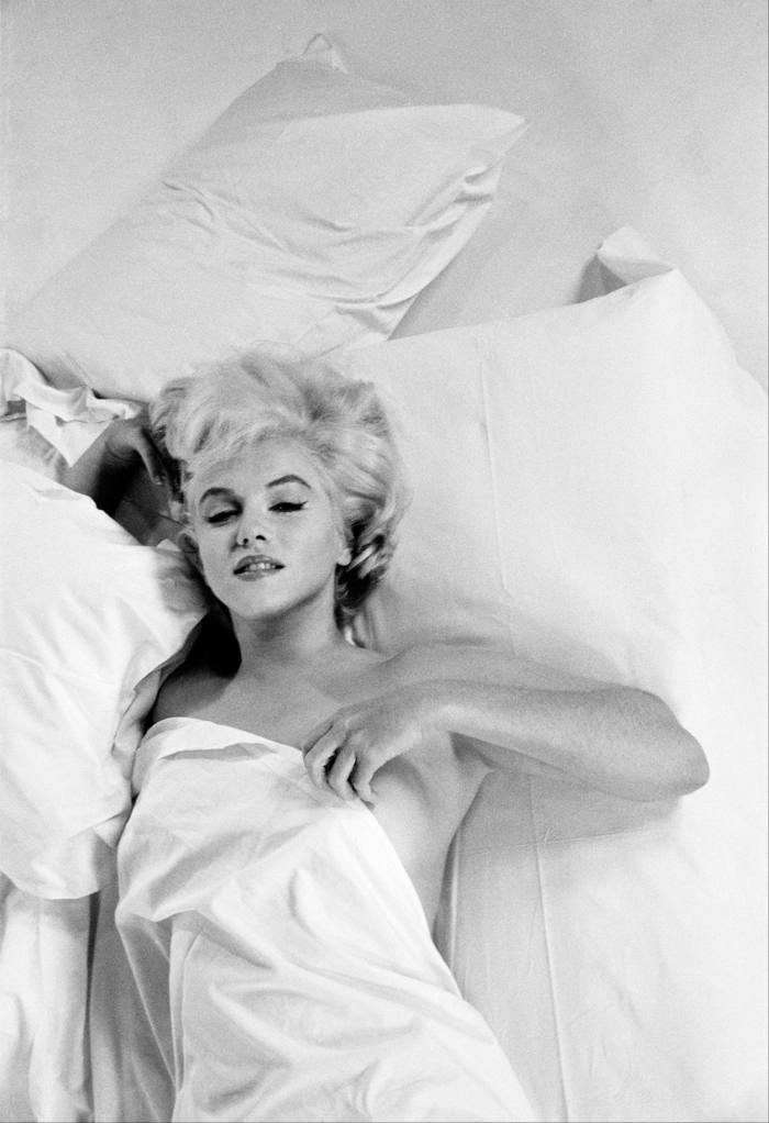 Marilyn Monroe resting between takes during a photographic studio session in Hollywood
