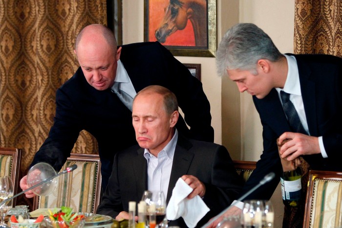Yevgeny Prigozhin serves Vladimir Putin during a dinner in 2011 at Prigozhin’s restaurant outside Moscow 