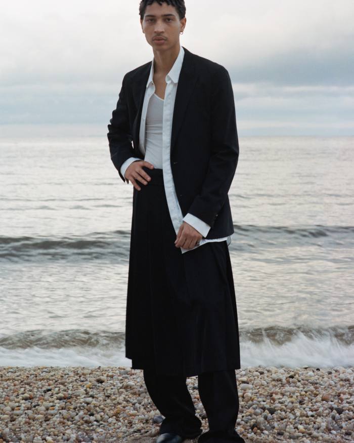 Luis wears Louis Vuitton wool blazer, £2,110, cotton shirt, £695, wool skirt, £1,710, and wool trousers, £695. James Perse cotton top, £‌126