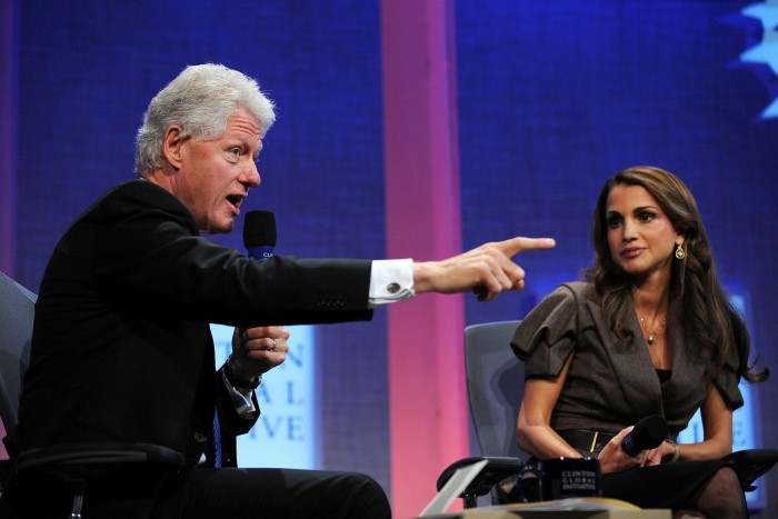 Clinton makes a point as Queen Rania of Jordan, right, looks on at one of the Clinton Global Initiative’s meetings in New York 