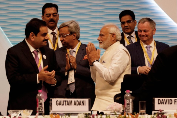 Gautam Adani with Narendra Modi at a summit in Gandhinagar in 2019. The businessman has been a zealous champion of the prime minister’s agenda since he came to power in 2014