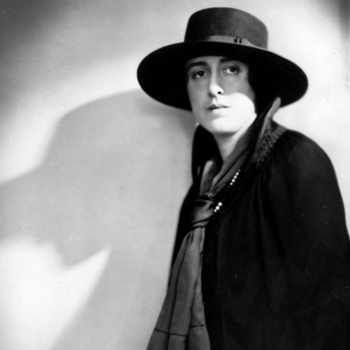 Black and white photograph of Vita Sackville West wearing a wide-brimmed hat gazing past the camera