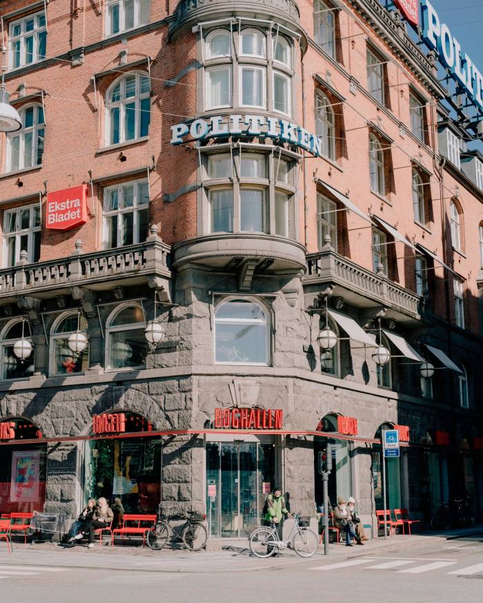 The offices of the Danish broadsheet ‘Politiken’, with passers-by crossing the square in front of it