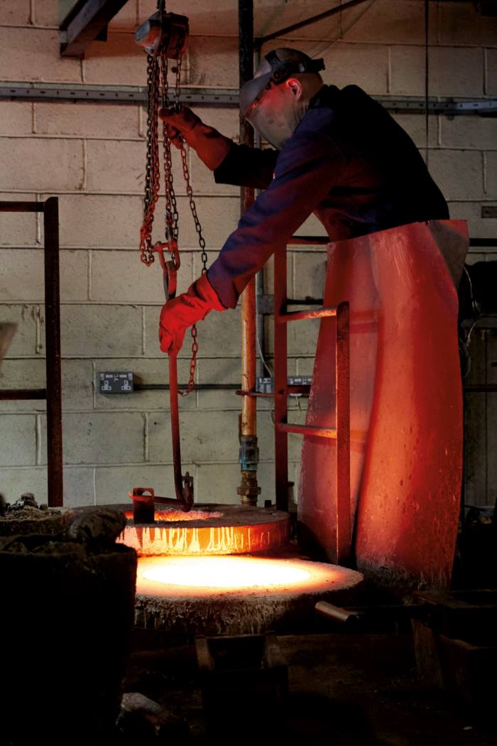 worker smelting metal