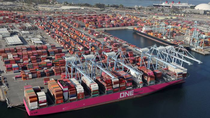 Shipping containers are unloaded from ships at a container terminal at the Port of Long Beach-Port of Los Angeles complex