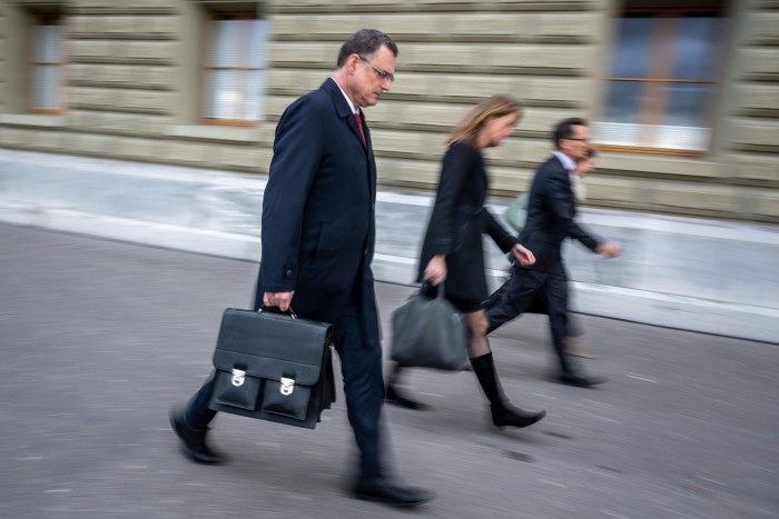 Chairman of the Swiss National Bank Thomas Jordan, left, with his team leaves the Swiss Federal Department of Finance after talks on the Credit Suisse crisis